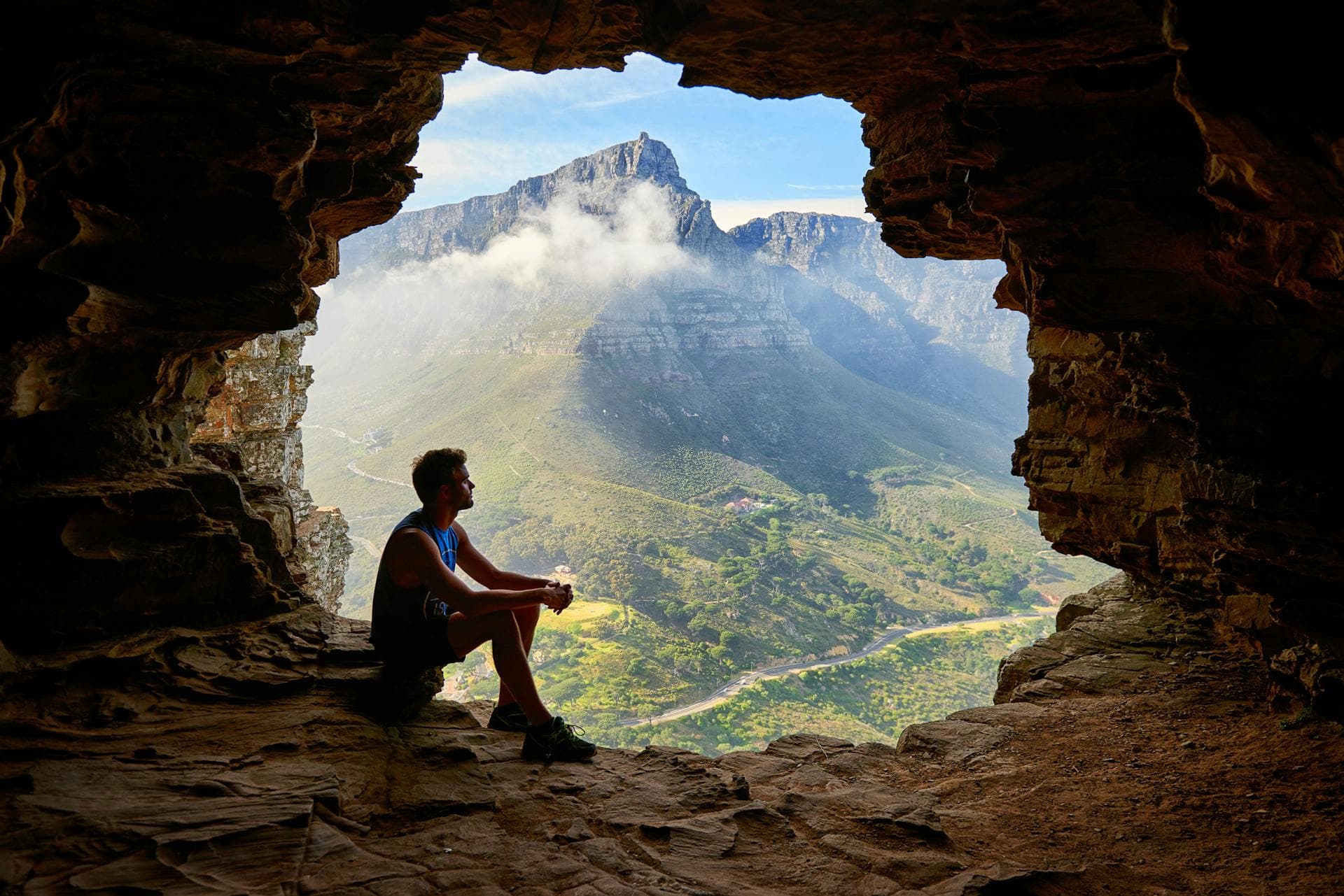 Man sitting in cabe looking out